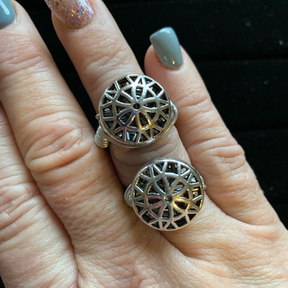 Silver medallion ring.